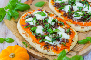 Homemade pumpkin, beef and mozzarella naan with basil and honey drizzle